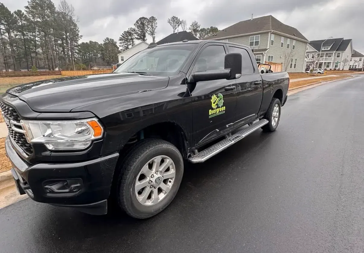 Evergreen work truck at a residential project